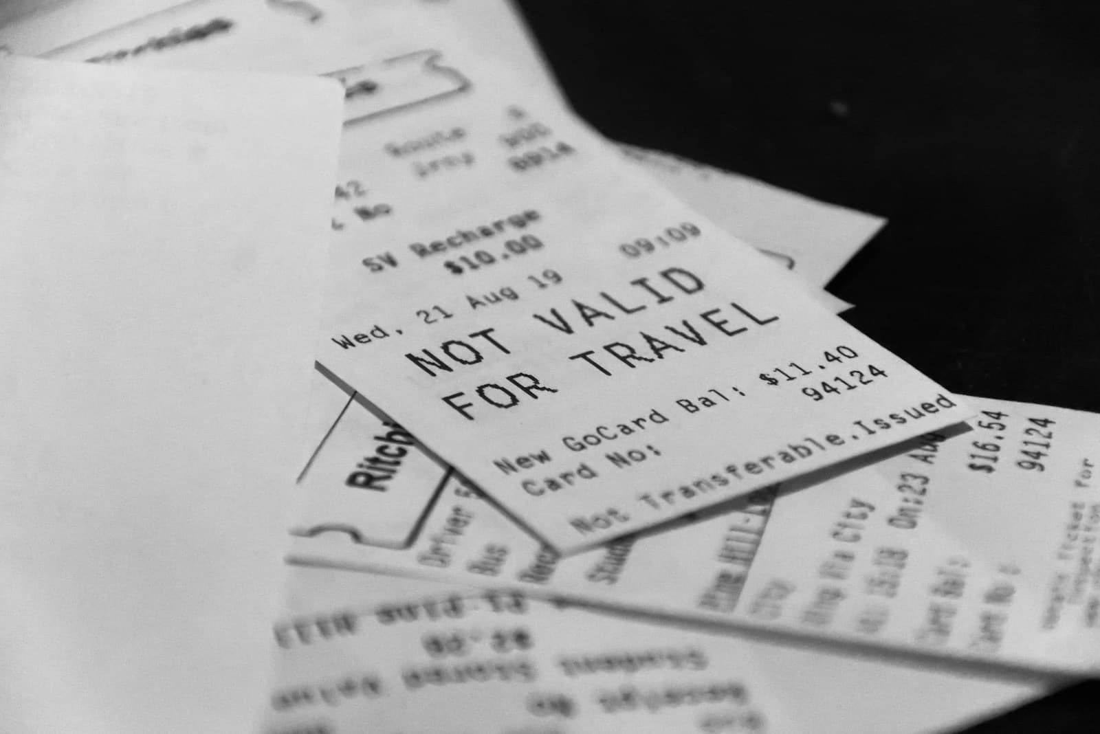A pile of fading printed receipts, the fragile paper trail behind rental property deductions.