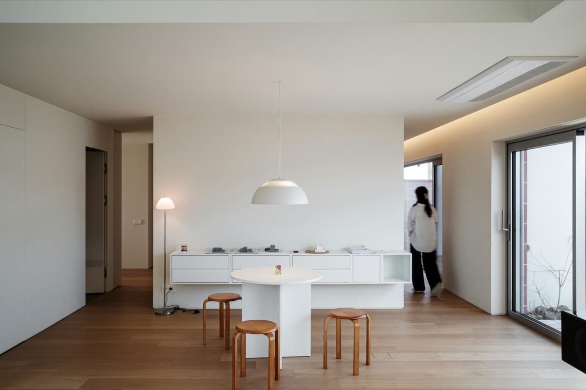 A bright, modern minimalist living room interior in an Australian home.