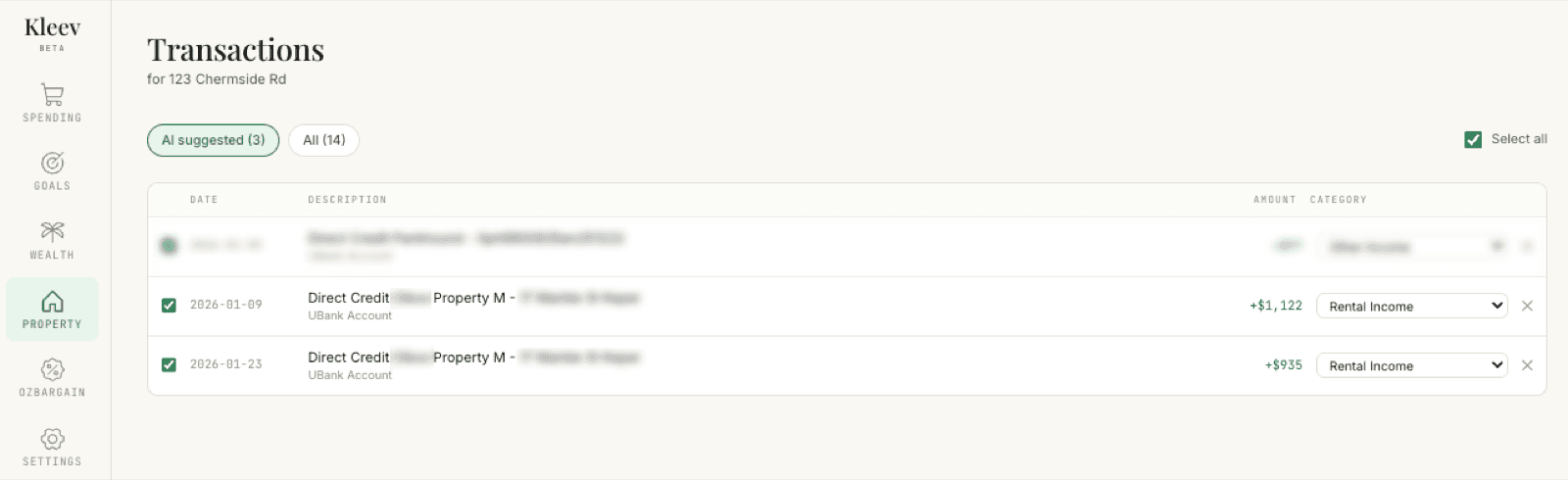 The transaction list with the AI suggested (3) filter active: a greyed-out already-tagged row at the top, two pre-ticked Direct Credit rent deposits of +$1,122 and +$935 with Rental Income pre-selected in their category dropdowns, a checked Select all control in the top right, and an ✕ at the end of each row